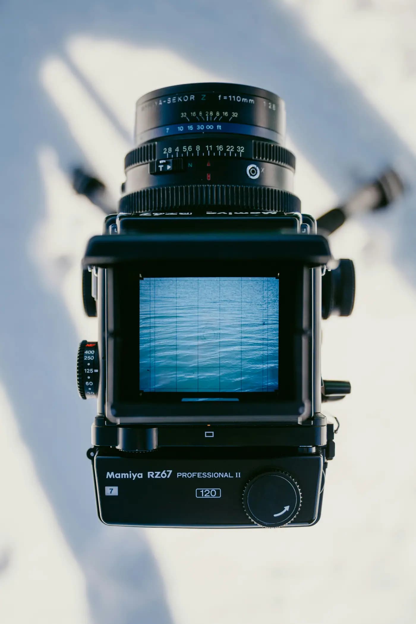 Medium-format camera showing rippled water on the viewfinder.
